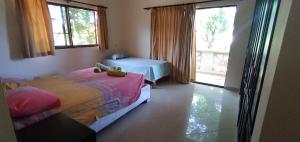 Ένα ή περισσότερα κρεβάτια σε δωμάτιο στο B&B Pavillion