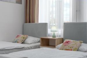 Posteľ alebo postele v izbe v ubytovaní Nasze Kamienice Apartament Express Rzeszów Główny