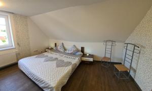Postel nebo postele na pokoji v ubytování Ferienwohnung Utkiek