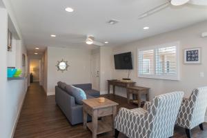 a living room with a couch and a table at 1202 South Pacific in Oceanside
