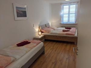 Postel nebo postele na pokoji v ubytování Ferienwohnung MonSevi