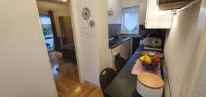 Kuchyň nebo kuchyňský kout v ubytování Mely Apartment + 10 fotografií