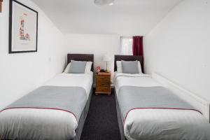 Postel nebo postele na pokoji v ubytování Apollo Hotel Kings Cross