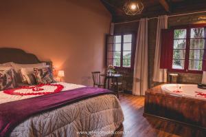 Un pat sau paturi într-o cameră la Casa Vêneto -Vale dos Vinhedos