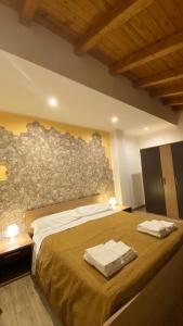 A bed or beds in a room at Spacious Apartment in Zafferana Etnea 65 m² with Private Garden