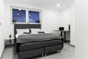 Ένα ή περισσότερα κρεβάτια σε δωμάτιο στο Auszeit Apartment WESTEND +11 φωτογραφίες