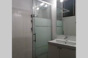 a bathroom with a shower and a sink and a mirror at Casa Melchor, amanecer y trabajar mirando al mar in Santa Cruz de la Palma +9 photos
