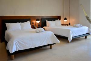 Postel nebo postele na pokoji v ubytování Mex Hoteles
