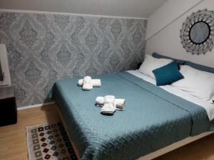 Giường trong phòng chung tại Apartment Stasha with free access to gym