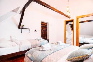 Säng eller sängar i ett rum på Villa Taborec