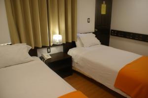 Postel nebo postele na pokoji v ubytování Hotel Samanapaq