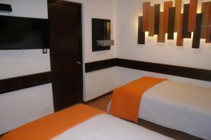 Postel nebo postele na pokoji v ubytování Hotel Samanapaq