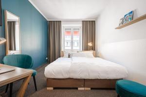 Postel nebo postele na pokoji v ubytování Hotel Stachus