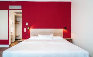 Postel nebo postele na pokoji v ubytování Hotel Stachus