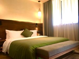 Letto o letti in una camera di Jinling Onejoy Hotel