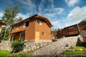 a house with a stone path in front of it at Sacred Valley View in Urubamba