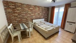 Posteľ alebo postele v izbe v ubytovaní Dalma Apartment