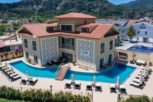 an aerial view of a villa with a swimming pool at Dna Hotel Dalyan in Dalyan