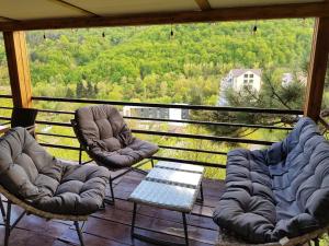 a chair with a blanket on top of it at Popock Dilijan 1 in Dilijan
