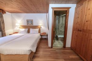 Postel nebo postele na pokoji v ubytování Hotel Steinbock