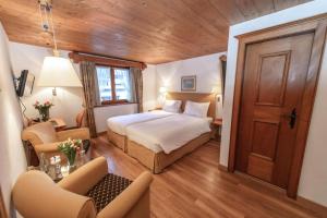 Postel nebo postele na pokoji v ubytování Hotel Steinbock