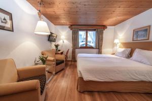 Postel nebo postele na pokoji v ubytování Hotel Steinbock
