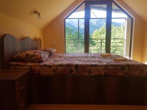 Llit o llits en una habitació de Guest House Sando