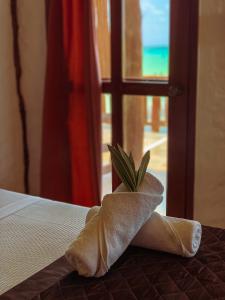 Postel nebo postele na pokoji v ubytování Golden Paradise Beachfront