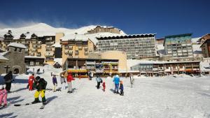 a group of people on skis in the snow at Studio sur les pistes in Bagnères-de-Bigorre