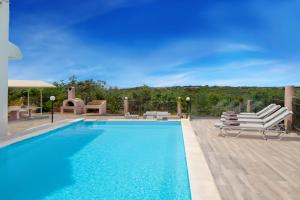 The swimming pool at or close to Villa Elihrisos