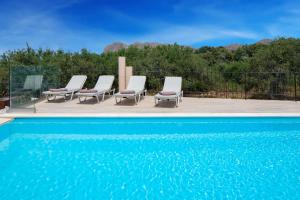 The swimming pool at or close to Villa Elihrisos