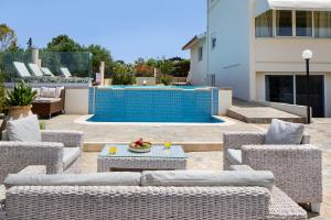 The swimming pool at or close to Villa Elihrisos