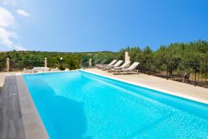 The swimming pool at or close to Villa Elihrisos
