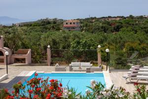 The swimming pool at or close to Villa Elihrisos