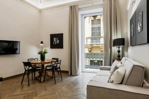 A television and/or entertainment centre at Ferrini Home - Etnea Portrait