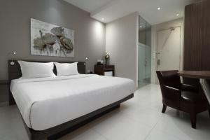Postel nebo postele na pokoji v ubytování Sun Boutique Hotel