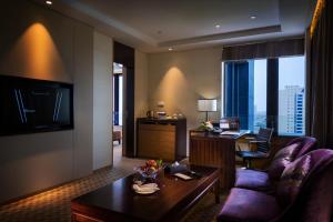 TV a/nebo společenská místnost v ubytování Kunshan Jinling Hotel