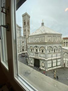 a view of a large building from a window at Duomo View in Florence