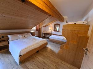 Postel nebo postele na pokoji v ubytování Hotel Piedibosco
