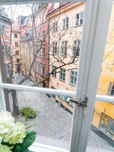 
a window that is open in a building at Castanea Old Town Hostel in Stockholm
