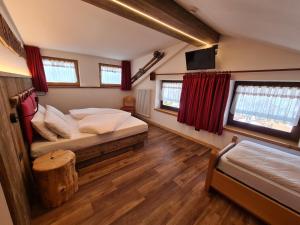 Postel nebo postele na pokoji v ubytování Hotel Piedibosco