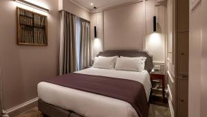 Postel nebo postele na pokoji v ubytování Hotel Smeraldo