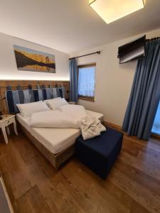 Postel nebo postele na pokoji v ubytování Hotel Piedibosco