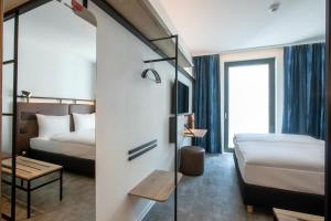 Posteľ alebo postele v izbe v ubytovaní H2 Hotel Budapest