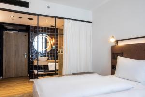 Posteľ alebo postele v izbe v ubytovaní H2 Hotel Budapest