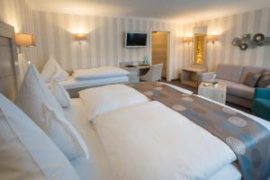 Postel nebo postele na pokoji v ubytování Hotel Garni Fürst von Waldeck