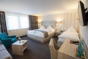 Postel nebo postele na pokoji v ubytování Hotel Garni Fürst von Waldeck