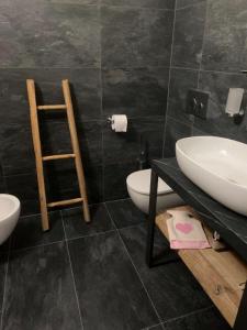 Et badeværelse på Appartamento Tapì
