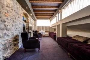 a living room with a couch and chairs and a table at Boutique Hotel Hippocampus in Kotor