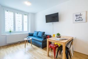 Televisor o centre d'entreteniment de FeelGood Apartments SmartLiving | contactless check-in